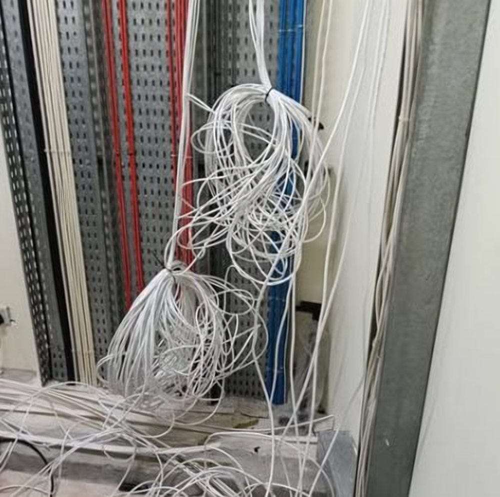 Bundles of network cable pulled through a cable riser